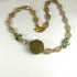 Quartz Crystal Necklace with Green and Gold Beaded Bead Accent