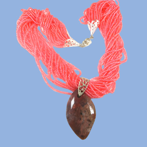 Pink Multi-strand necklace with gemstone pendant