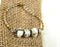 White Artisan Bead and Gold Bangle Bracelet