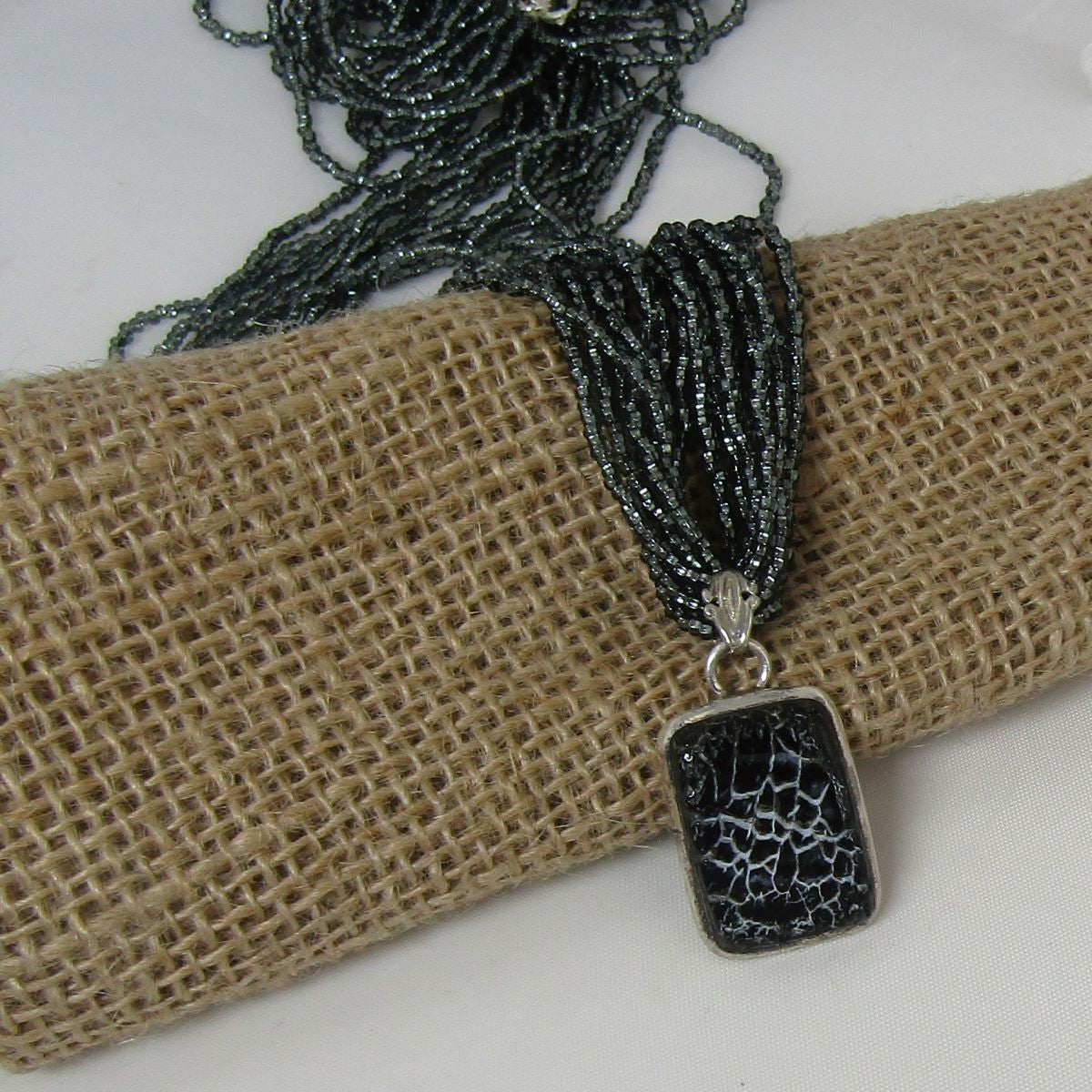 Charcoal Multi-strand Necklace with Dinosaur Bone Pendant - VP's Jewelry