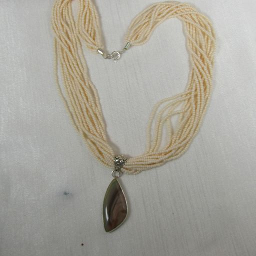 Cream  Multi-strand Necklace with  Petrified Wood Pendant