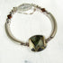 Beige and Brown Artisan Bead Silver Bangle Bracelet